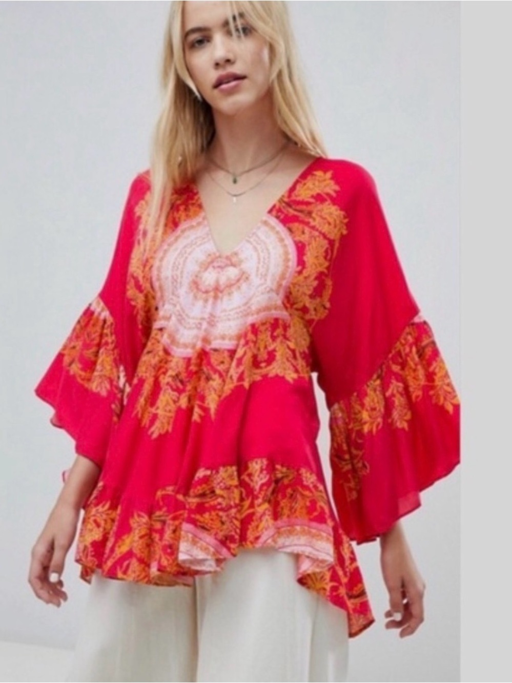 Free People Sunset Dreams tunic top in red with a floral medallion print